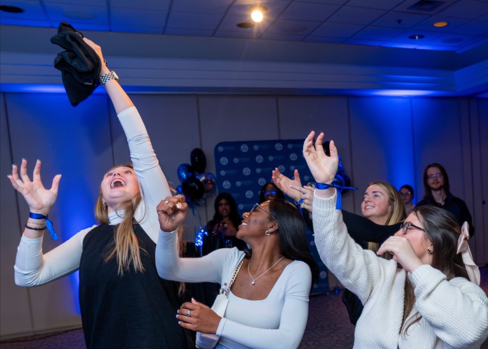 Girl grabs the thrown t-shirt